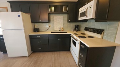 TWO BEDROOM, ONE BATHROOM MOBILE HOME IN AN ACTIVE 55+ COMMUNITY on River Run Golf Links in Florida - for sale on GolfHomes.com, golf home, golf lot