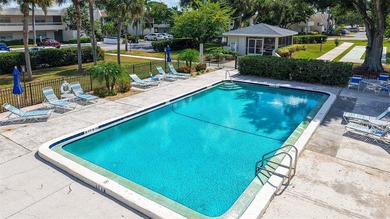 Rarely available 3-bedroom end unit featuring sweeping golf on Palm Aire Country Club of Sarasota in Florida - for sale on GolfHomes.com, golf home, golf lot
