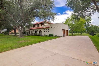 Welcome to this beautifully maintained Spanish-style two-story on Victoria Country Club in Texas - for sale on GolfHomes.com, golf home, golf lot