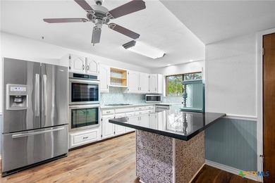 Welcome to this beautifully maintained Spanish-style two-story on Victoria Country Club in Texas - for sale on GolfHomes.com, golf home, golf lot