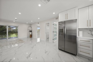 This beautifully renovated residence offers a seamless blend of on The Glades Golf and Country Club in Florida - for sale on GolfHomes.com, golf home, golf lot