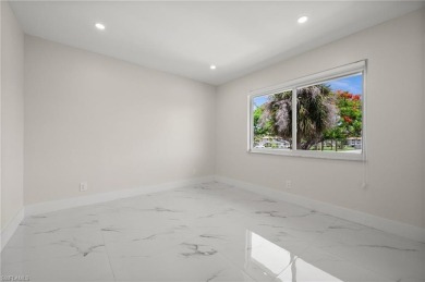This beautifully renovated residence offers a seamless blend of on The Glades Golf and Country Club in Florida - for sale on GolfHomes.com, golf home, golf lot