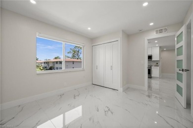 This beautifully renovated residence offers a seamless blend of on The Glades Golf and Country Club in Florida - for sale on GolfHomes.com, golf home, golf lot