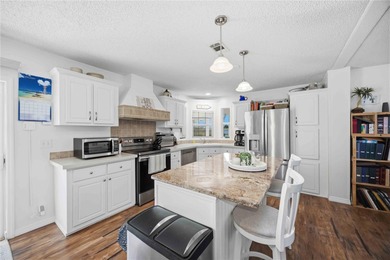 COZY AND UPDATED 2/2 home located in the desirable 55+ community on Twin Isles Country Club in Florida - for sale on GolfHomes.com, golf home, golf lot