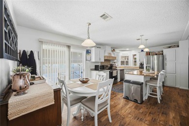 COZY AND UPDATED 2/2 home located in the desirable 55+ community on Twin Isles Country Club in Florida - for sale on GolfHomes.com, golf home, golf lot