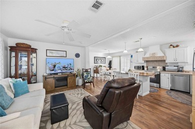 COZY AND UPDATED 2/2 home located in the desirable 55+ community on Twin Isles Country Club in Florida - for sale on GolfHomes.com, golf home, golf lot