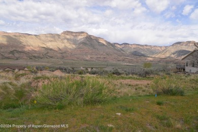 This exceptional .52-acre lot, borders the 17th fairway of on Battlement Mesa Golf Course in Colorado - for sale on GolfHomes.com, golf home, golf lot