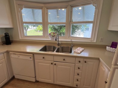 Welcome to this charming two-bedroom, two-bath home located in on Pine Lakes Country Club in Florida - for sale on GolfHomes.com, golf home, golf lot