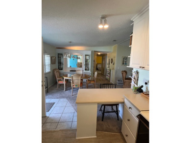 Welcome to this charming two-bedroom, two-bath home located in on Pine Lakes Country Club in Florida - for sale on GolfHomes.com, golf home, golf lot