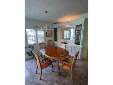 Welcome to this charming two-bedroom, two-bath home located in on Pine Lakes Country Club in Florida - for sale on GolfHomes.com, golf home, golf lot