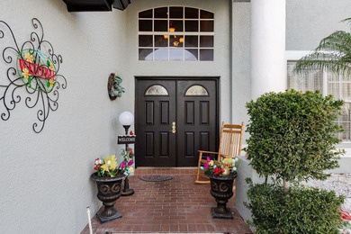 Exceptional and stunning executive pool home situated on a pond on Heritage Harbor Golf and Country Club in Florida - for sale on GolfHomes.com, golf home, golf lot