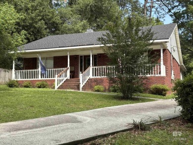 CHARMING three-bedroom, two-bath brick home situated in a quiet on Lake Forest Yacht and Country Club in Alabama - for sale on GolfHomes.com, golf home, golf lot