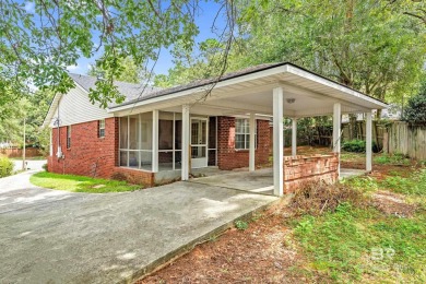 CHARMING three-bedroom, two-bath brick home situated in a quiet on Lake Forest Yacht and Country Club in Alabama - for sale on GolfHomes.com, golf home, golf lot