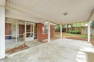 CHARMING three-bedroom, two-bath brick home situated in a quiet on Lake Forest Yacht and Country Club in Alabama - for sale on GolfHomes.com, golf home, golf lot