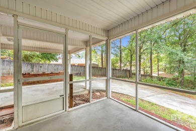 CHARMING three-bedroom, two-bath brick home situated in a quiet on Lake Forest Yacht and Country Club in Alabama - for sale on GolfHomes.com, golf home, golf lot