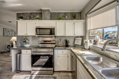 If you're looking for a home with a breathtaking view, this is on Pine Lakes Country Club in Florida - for sale on GolfHomes.com, golf home, golf lot