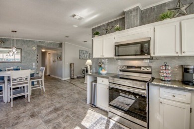 If you're looking for a home with a breathtaking view, this is on Pine Lakes Country Club in Florida - for sale on GolfHomes.com, golf home, golf lot