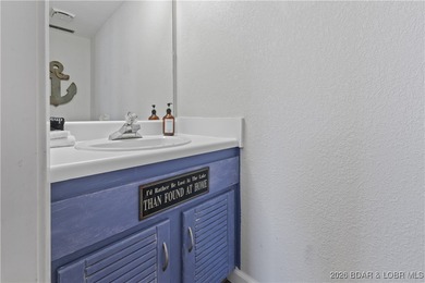 Located in the iconic Tan Tar A Estates, adjacent to on The Oaks Golf Course in Missouri - for sale on GolfHomes.com, golf home, golf lot