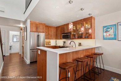 This desirable Country Club Townhome is located adjacent to the on The Snowmass Club in Colorado - for sale on GolfHomes.com, golf home, golf lot