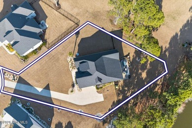 Step inside this luxury modern coastal craftsman home, perfectly on Sea Trail Golf Resort in North Carolina - for sale on GolfHomes.com, golf home, golf lot