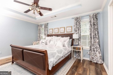 Welcome to this beautifully maintained three-level end-unit on Sugar Hill Golf Club in Georgia - for sale on GolfHomes.com, golf home, golf lot