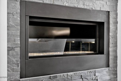 Step inside this luxury modern coastal craftsman home, perfectly on Sea Trail Golf Resort in North Carolina - for sale on GolfHomes.com, golf home, golf lot