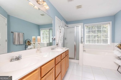 Welcome to this beautifully maintained three-level end-unit on Sugar Hill Golf Club in Georgia - for sale on GolfHomes.com, golf home, golf lot