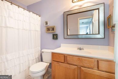 Welcome to this beautifully maintained three-level end-unit on Sugar Hill Golf Club in Georgia - for sale on GolfHomes.com, golf home, golf lot