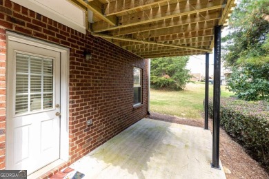 Welcome to this beautifully maintained three-level end-unit on Sugar Hill Golf Club in Georgia - for sale on GolfHomes.com, golf home, golf lot