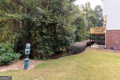 Welcome to this beautifully maintained three-level end-unit on Sugar Hill Golf Club in Georgia - for sale on GolfHomes.com, golf home, golf lot