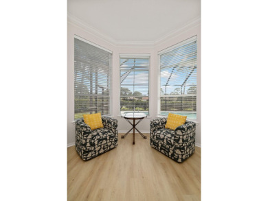 This beautifully updated home in the gated golf community of on Emerald Bay Golf Club in Florida - for sale on GolfHomes.com, golf home, golf lot