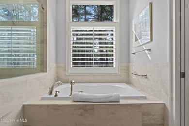 Stunning custom-built golf-front home overlooking the 2nd hole on Pinewild Country Club of Pinehurst in North Carolina - for sale on GolfHomes.com, golf home, golf lot