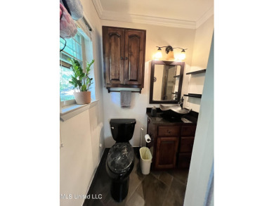 Come see this furnished, split level home that is move-in ready on Sunkist Country Club, Inc. in Mississippi - for sale on GolfHomes.com, golf home, golf lot