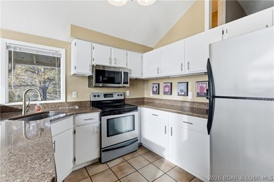 Located in the iconic Tan Tar A Estates, adjacent to on The Oaks Golf Course in Missouri - for sale on GolfHomes.com, golf home, golf lot