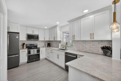 This stunning model home is tucked into the north end of the on Lake Worth Municipal Golf Course in Florida - for sale on GolfHomes.com, golf home, golf lot
