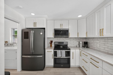This stunning model home is tucked into the north end of the on Lake Worth Municipal Golf Course in Florida - for sale on GolfHomes.com, golf home, golf lot