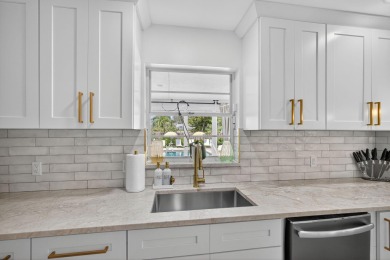This stunning model home is tucked into the north end of the on Lake Worth Municipal Golf Course in Florida - for sale on GolfHomes.com, golf home, golf lot