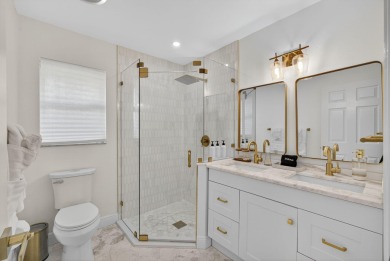 This stunning model home is tucked into the north end of the on Lake Worth Municipal Golf Course in Florida - for sale on GolfHomes.com, golf home, golf lot