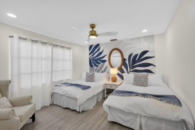 This stunning model home is tucked into the north end of the on Lake Worth Municipal Golf Course in Florida - for sale on GolfHomes.com, golf home, golf lot