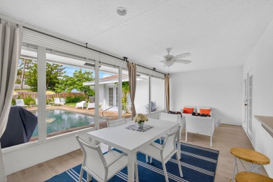 This stunning model home is tucked into the north end of the on Lake Worth Municipal Golf Course in Florida - for sale on GolfHomes.com, golf home, golf lot
