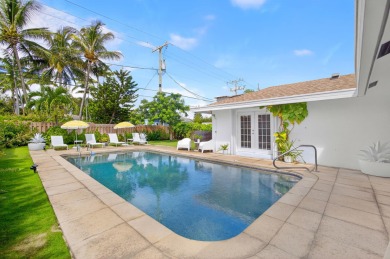 This stunning model home is tucked into the north end of the on Lake Worth Municipal Golf Course in Florida - for sale on GolfHomes.com, golf home, golf lot