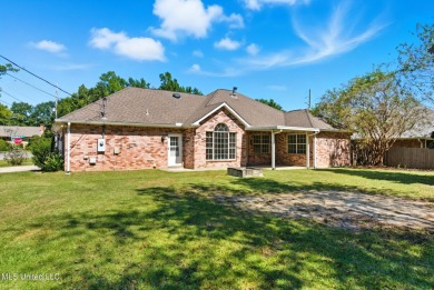 Beautiful 3-Bedroom, 2-Bath Home on Half-Acre Corner Lot in on Diamondhead Country Club in Mississippi - for sale on GolfHomes.com, golf home, golf lot