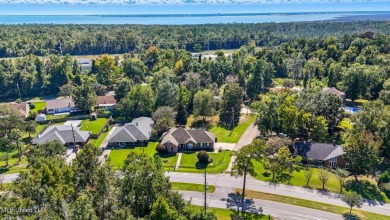 Beautiful 3-Bedroom, 2-Bath Home on Half-Acre Corner Lot in on Diamondhead Country Club in Mississippi - for sale on GolfHomes.com, golf home, golf lot