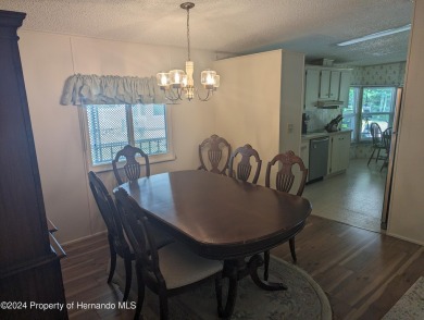 NICE 2 BED, 2 BATH WITH A 1 CAR GARAGE AND A 2 CAR CARPORT IN on Continental Country Club in Florida - for sale on GolfHomes.com, golf home, golf lot