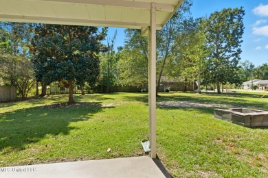 Beautiful 3-Bedroom, 2-Bath Home on Half-Acre Corner Lot in on Diamondhead Country Club in Mississippi - for sale on GolfHomes.com, golf home, golf lot