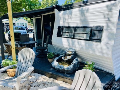 This beautifully remodeled tiny home is perfect for your weekend on Densons Creek Golf Course in North Carolina - for sale on GolfHomes.com, golf home, golf lot