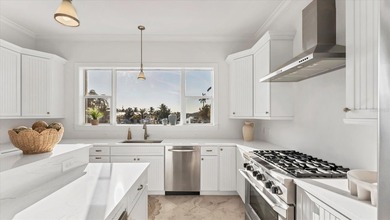 Elevated waterfront living in Key Royale -- built for confidence on Key Royale Club in Florida - for sale on GolfHomes.com, golf home, golf lot