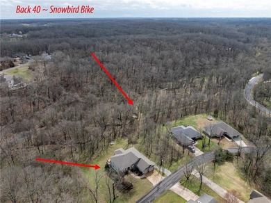 Located in one of Bella Vista's most sought after outdoor on Bella Vista - Metfield Golf Complex and Country Club in Arkansas - for sale on GolfHomes.com, golf home, golf lot