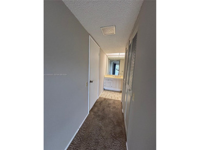 Welcome to resort-style living in this beautifully maintained on Wynmoor Golf Course in Florida - for sale on GolfHomes.com, golf home, golf lot