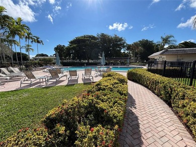 Welcome to resort-style living in this beautifully maintained on Wynmoor Golf Course in Florida - for sale on GolfHomes.com, golf home, golf lot